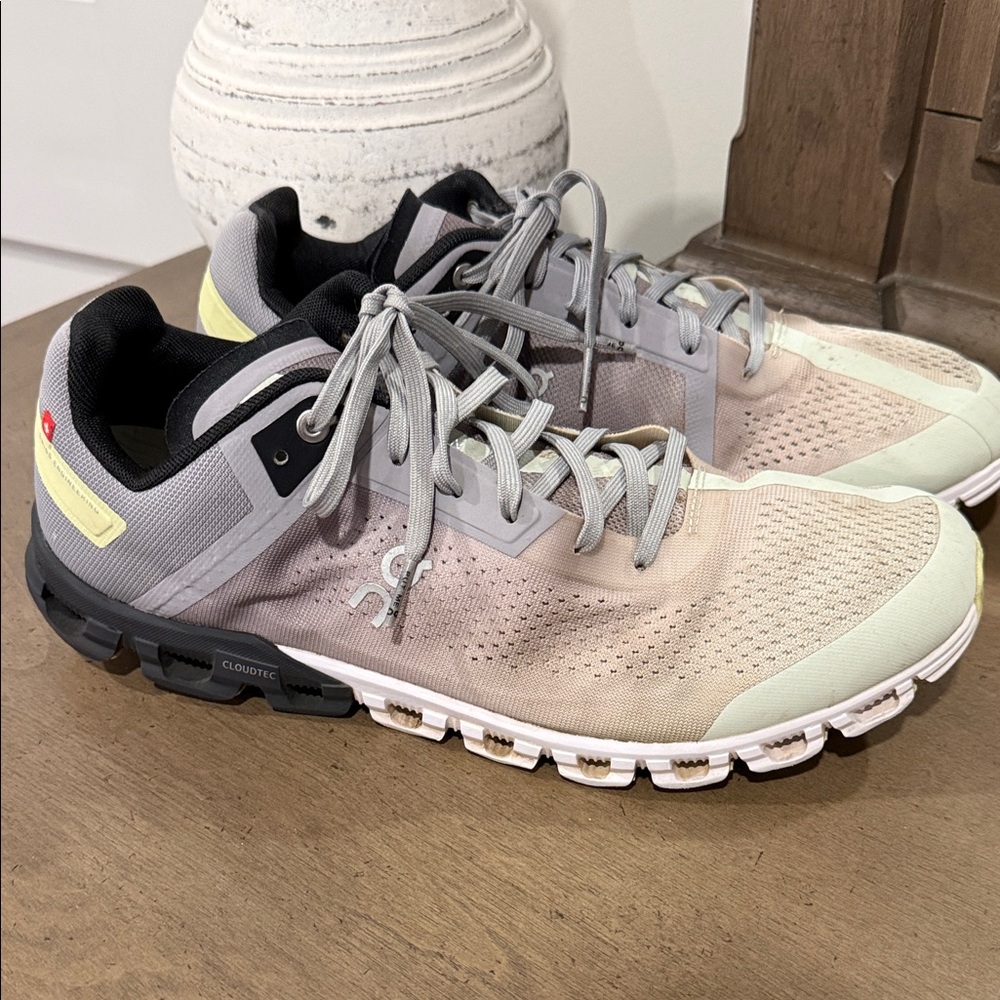 On Running Black and Gray Sneakers with Yellow Accents
